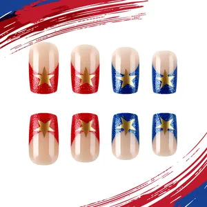 Detail of glittery red and blue press-on nails with gold star patterns and sparkle finish