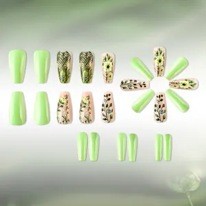Detail of 24pcs long coffin press-on nails with green floral art and glossy finish