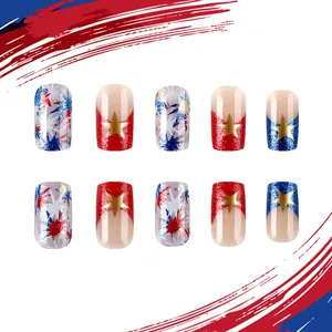 Macro shot of Fourth of July press-on nails with gold stars and red white blue patterns