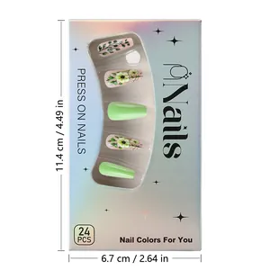 Close-up of green press-on nails with small flower patterns in holographic box