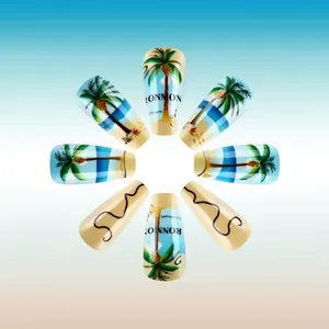 Long trapezoid press-on nails featuring tropical palm trees and beach scenery design