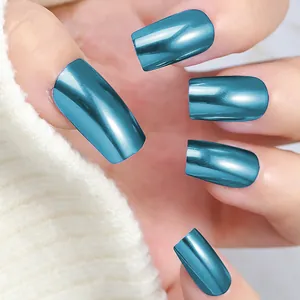 Macro shot of long coffin metallic mirror finish press-on nails in vibrant lake blue