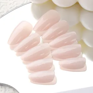 Medium almond cat-eye press-on nails in moonlight white with a high-shine pearlescent finish