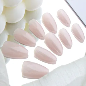 Detail of almond cat-eye glitter press-on nails in moonlight white on a mirror
