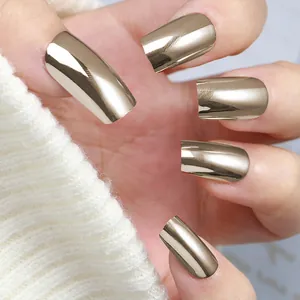 Detail shot of long square champagne gold mirror finish press-on nails for women