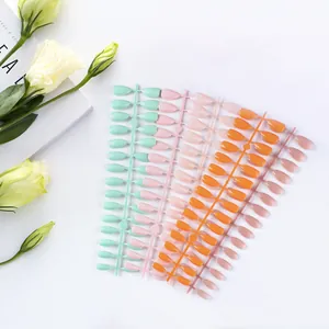 Glossy almond press-on nails in mint green, pink, orange, and purple color set