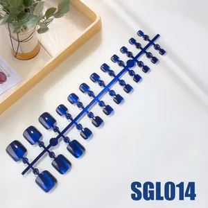 Deep blue cat eye press-on toenails set with shimmering magnetic finish on display