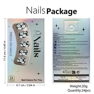 Macro view of Halloween ghost press-on nails set with holographic packaging and tools