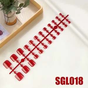 Detailed macro view of 24 pieces of deep red cat-eye jelly press-on toenails on frame