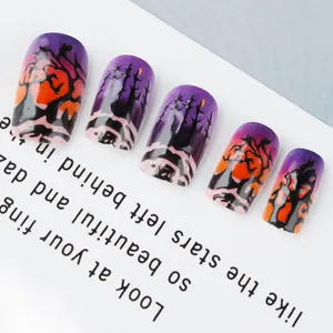Detailed macro view of purple Halloween press-on nails with forest and pumpkin designs