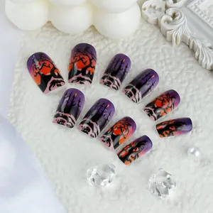 Detail of purple Halloween press-on nails featuring 3D embossed dark forest patterns