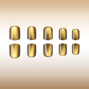 Detailed view of short square amber cat-eye press-on nails with sparkling finish