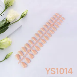 Detailed macro view of 24 pieces almond-shaped press-on nails in soft nude pink