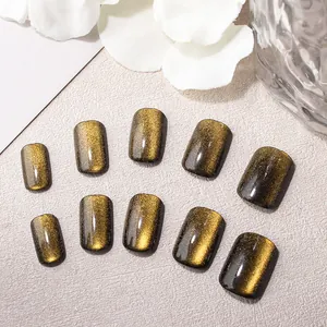 Short square cat eye press-on nails in amber gold with shimmering magnetic effect