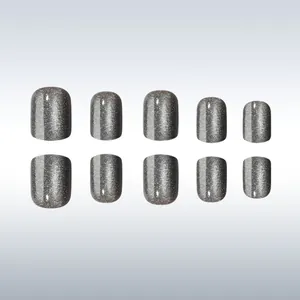 Detail view of 10-piece short square grey cat eye press-on nails with silver glitter finish
