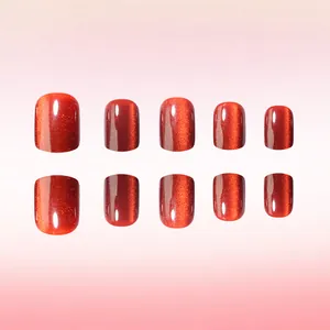 Macro shot of 10-piece short round cat-eye red-orange glossy press-on nails