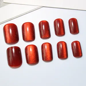 Sparkling red cat eye press-on nails with short square shape for a glossy salon look