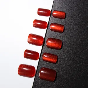 Deep red cat eye press-on nails with sparkling shimmer in rounded rectangular shape
