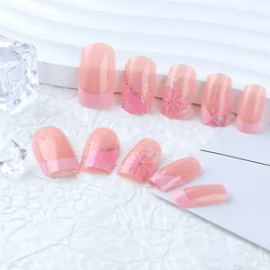 Medium square press-on nails with pink floral patterns and glitter finish accents