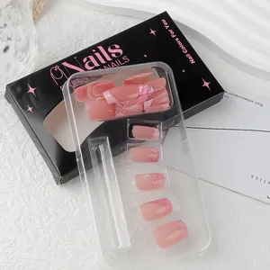 Pink press-on nail kit with floral designs and glitter finish in elegant gift box