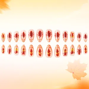 Glossy almond press-on nails with autumn maple leaf patterns and orange dot design