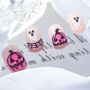 Detail of Halloween short square press-on nails with pink pumpkin and ghost patterns