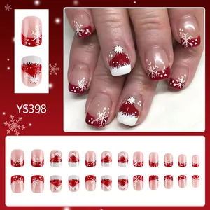 Short square Christmas press-on nails featuring Santa hat and snowflake patterns