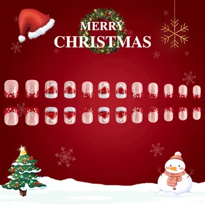 Detail of Christmas press-on nails with red snowflakes and festive hat patterns, 24pcs set