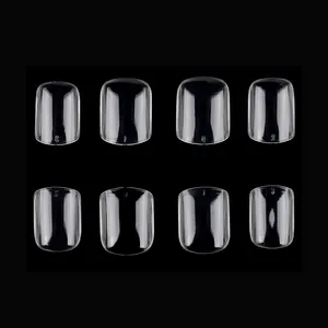Macro detail of clear square press-on nails featuring visible size number markings