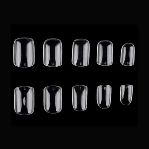Detailed view of clear press-on nails with size numbering on 10 different width sizes