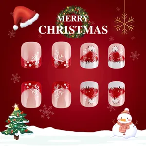 Short square Christmas press-on nails with red Santa hat and snowflake glitter patterns