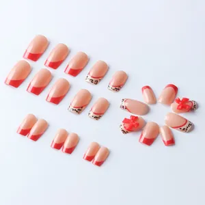 Square red French tip press-on nails with leopard print and 3D bow accents set