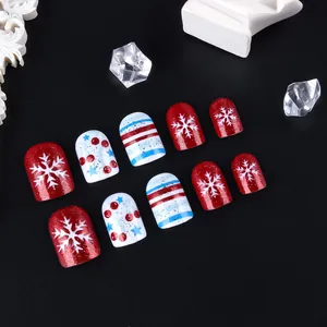 Uñas postizas de Navidad cortas y brillantes con purpurina roja azul y copos de nieve