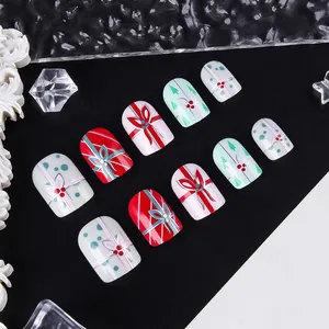 Short square Christmas press-on nails with 3D bows and festive holiday tree designs