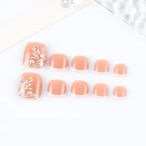 Pink French style press-on toenails with white vine patterns and colorful rhinestones