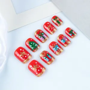 Short square red Christmas press-on nails with glitter, festive trees and star patterns