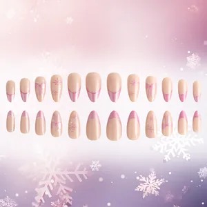 Pink French almond press on nails with snowflake patterns and 3D bow designs