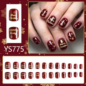 Unghie finte natalizie bordeaux con fiocchi di neve dorati e scritta Merry Christmas