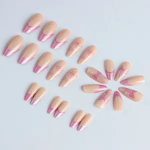 Pink French almond press-on nails with winter snowflake and bow designs, 24 piece set