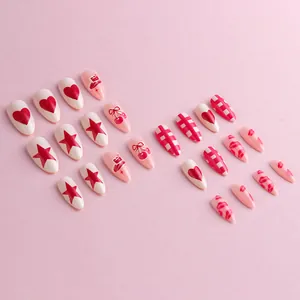 Almond shaped press-on nails with cute red heart, cherry, and star patterns for women