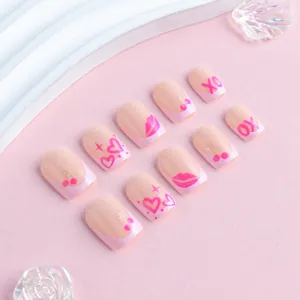 Short square pink heart press-on nails with XO cherry patterns and French tips