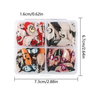 Detailed top view of Halloween press-on nail kit with pumpkin and ghost designs