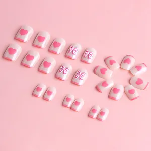 Short square press-on nails with 3D pink bows and heart designs in 24 piece set