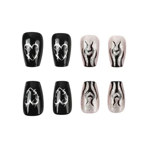 Detail of coffin nails with black heart thorns and pink glitter flame patterns