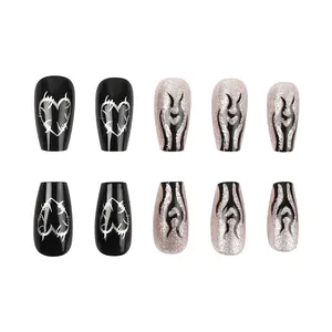 Glossy black heart thorn and silver glitter flame press-on nails in trapezoid shape