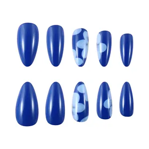 Glossy short blue press-on nails featuring cute light blue floral designs for women