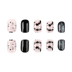Short glossy Halloween press-on nails with skull, bat patterns and silver glitter decor