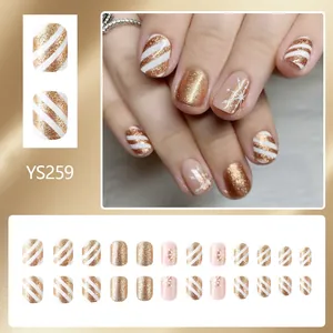 Short round Christmas press-on nails with champagne gold glitter and snowflake patterns