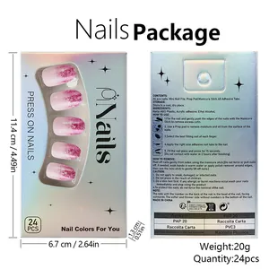 Pink gradient press-on nails with glitter snowflake design and tools in laser box