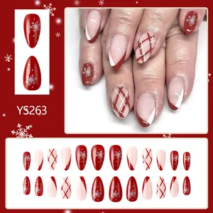 Short festive red and white Christmas press-on nails with snowflake and glitter designs